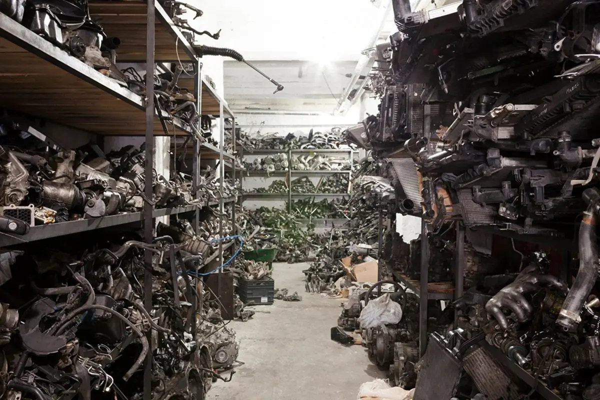 Warehouse filled with various metal machine parts.